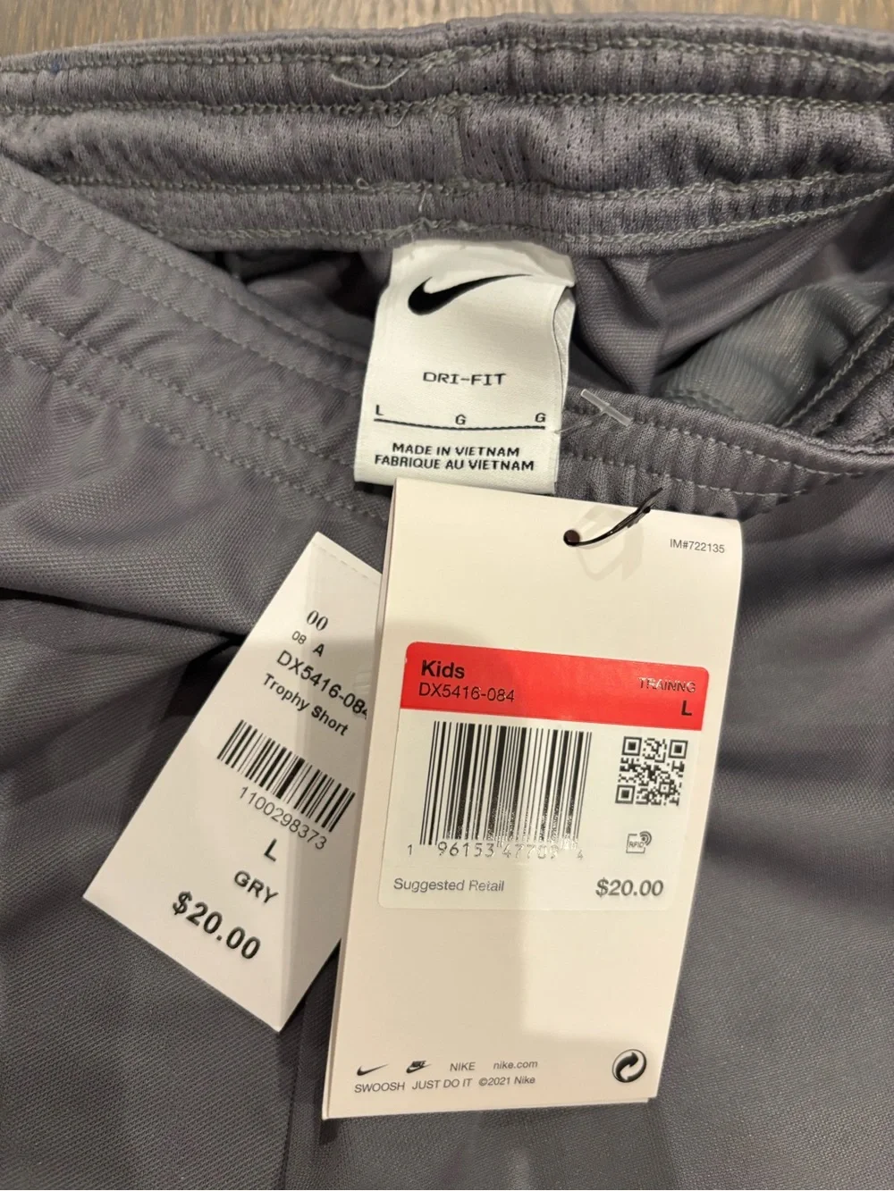 Nike Boys’ Gray Athletic Shorts with White Swoosh